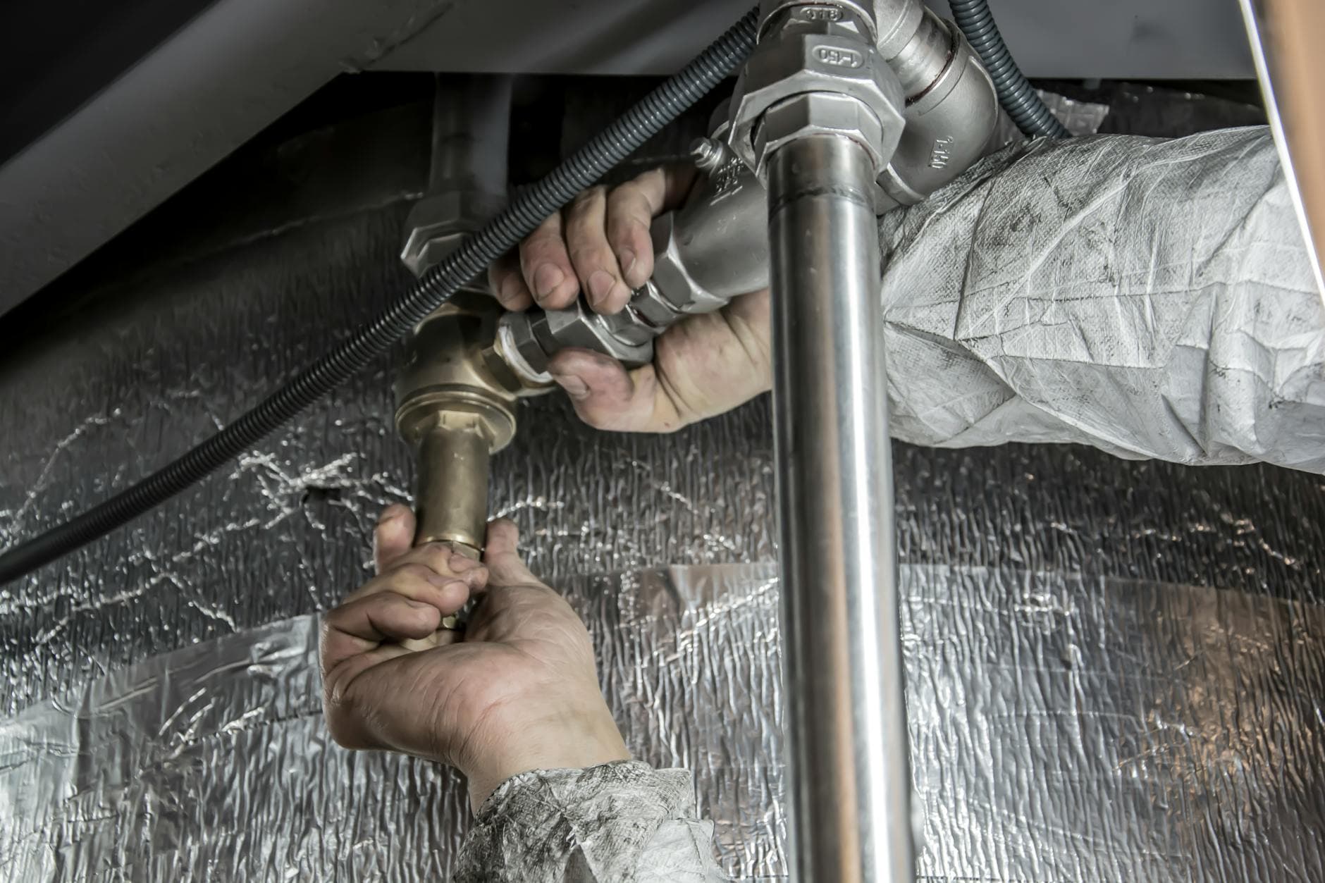 Plumber at a job site who needs AI receptionist software to handle inbound calls
