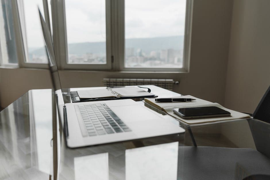 Business phone and laptop showing call flow configuration